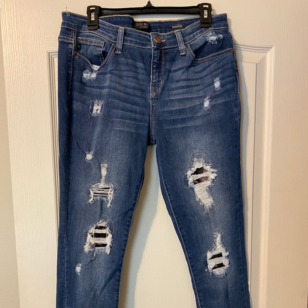 Just Blue distressed jeans with camo details.